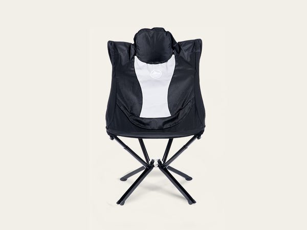 A black and white folding camp chair with a built-in headrest, shown from the front against a solid off-white background. EpiQ Folding Chair